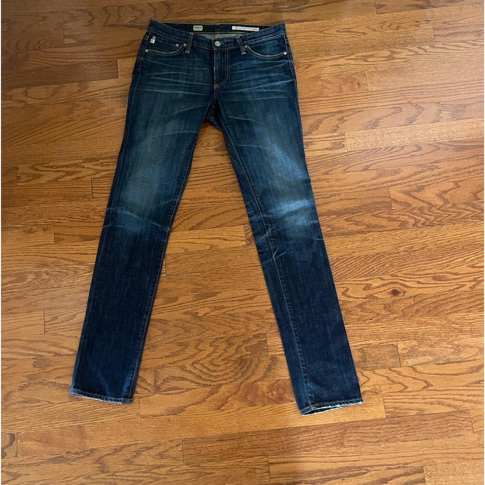 (AG) ADRIANO GOLDSCHMIED Dark Denim Skinny Straight Jeans.